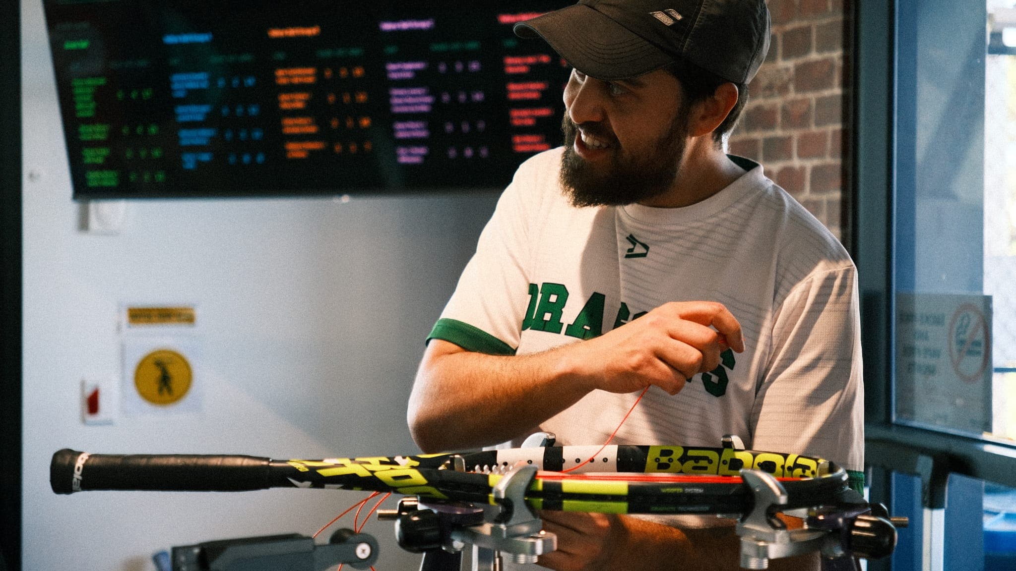 Bruno restringing a tennis racquet in Adelaide